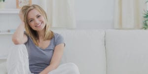 Women smiling on a couch